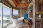 This soaking tub is positioned to take in views of the Morro Rock and Cayucos Shorline.